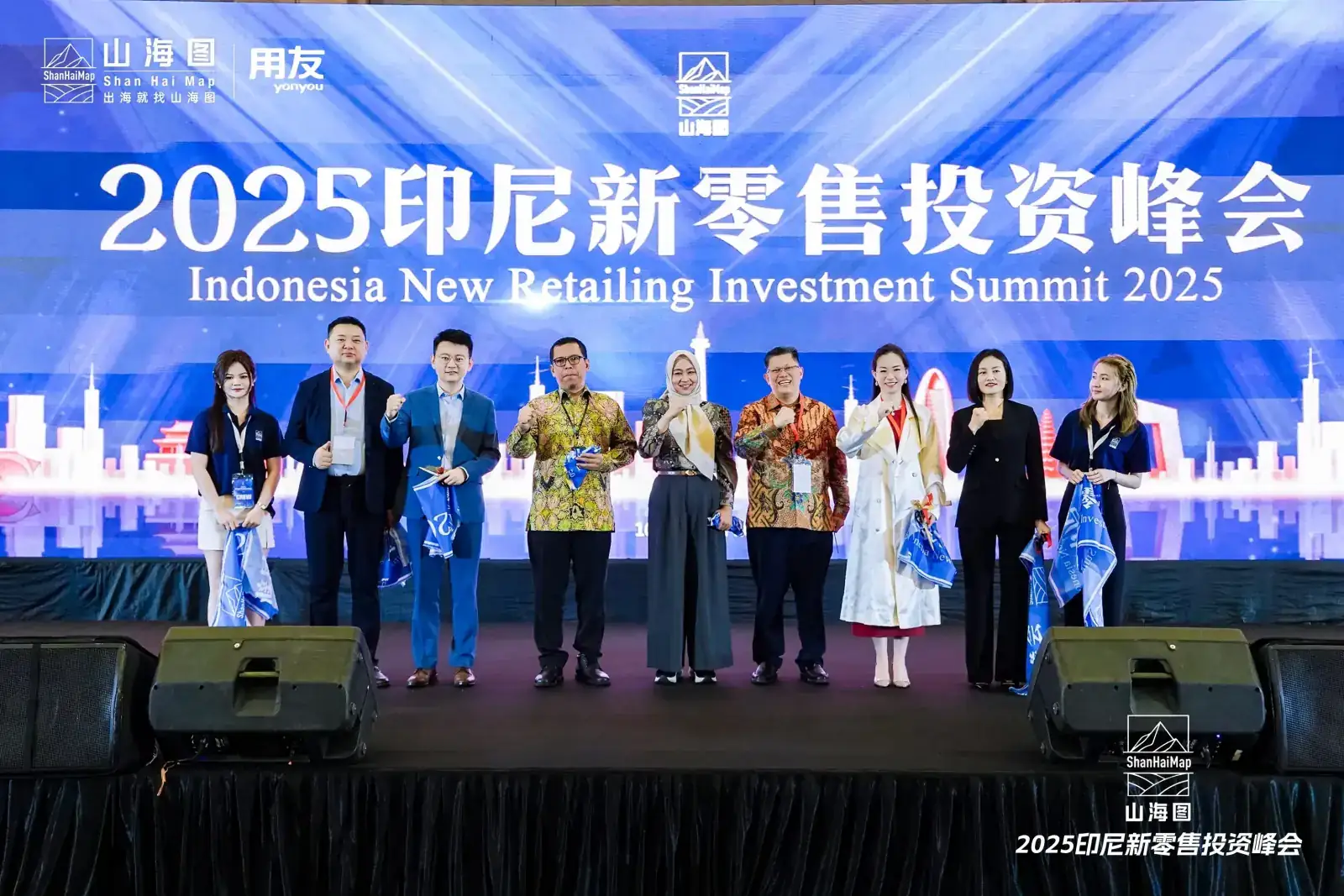 Guests and speakers posing together on stage at the Indonesia New Retailing Investment Summit 2025