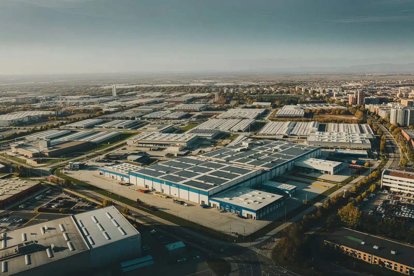 Factory and warehouse complex with solar-panel roofs, seen from above